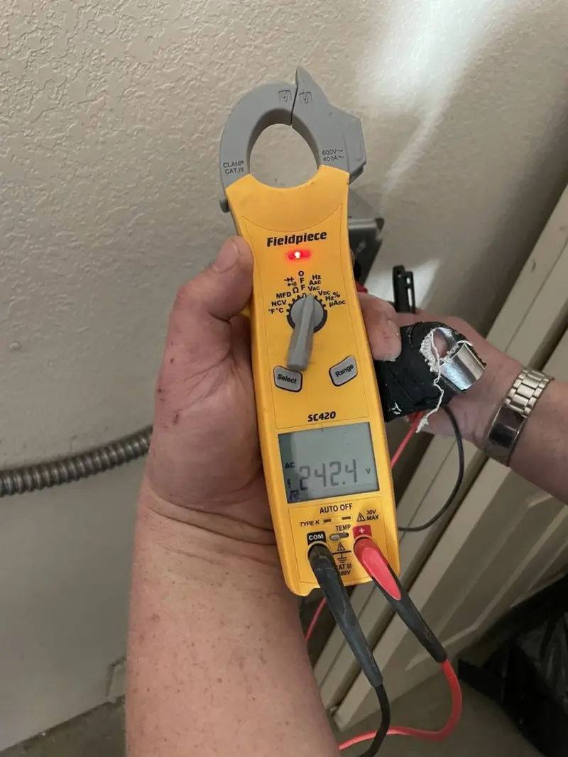 Voltage testing with clamp meter during Recessed Lighting Installation in Westminster